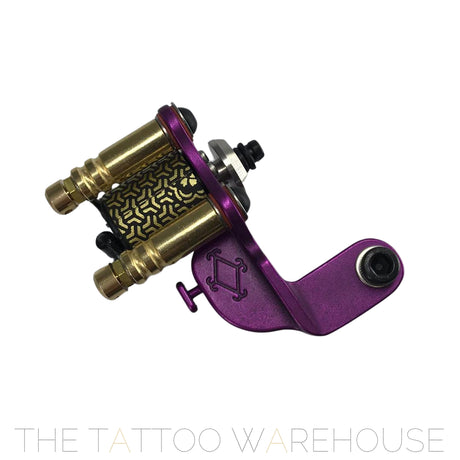 A Beautiful closeup of the Era Higa Quinke v.2s. Its aluminium frame is Purple. The Foulhaber motor has a geometric pattern originating from Japan. The best looking rotary tattoo machine on the market.