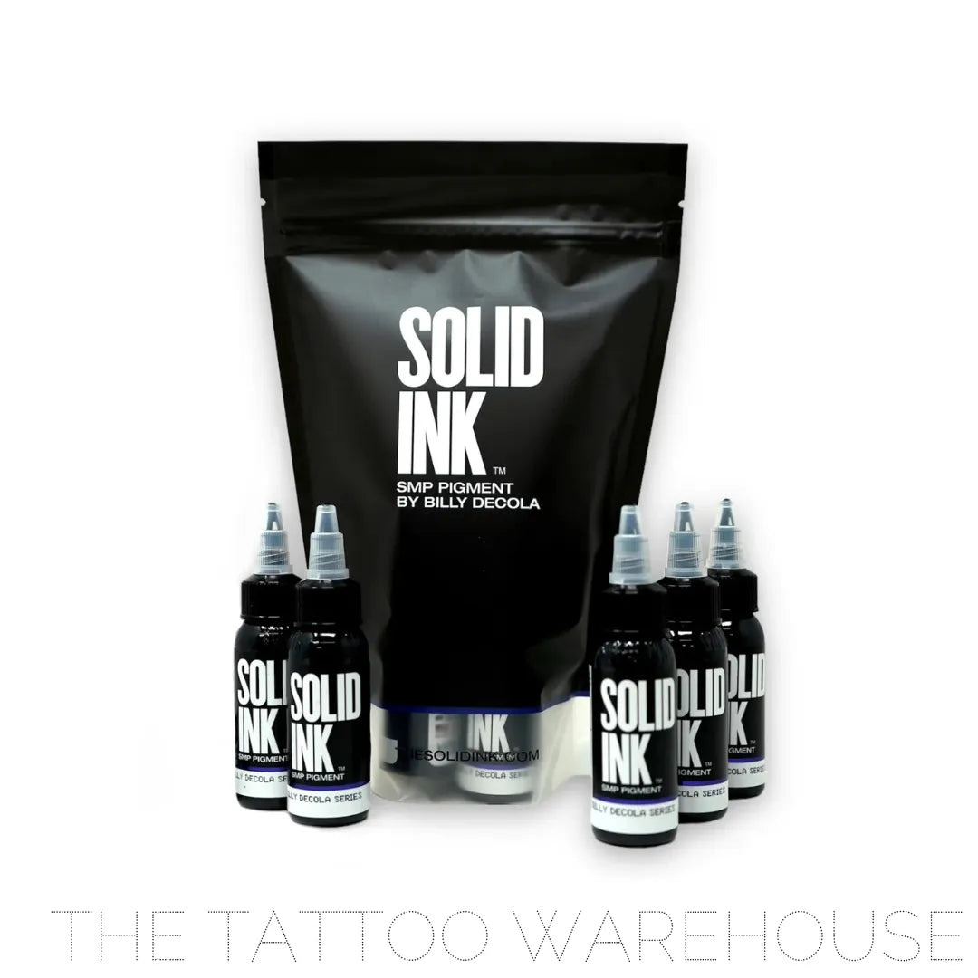 Five 1 ounce bottles of solid SMP inks standing up around a bag of SMP Pigment by Billy Decola.