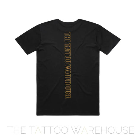 The back of Tattoos for Tails t-shirt. black t-shirt with gold logo of THE TATTOO WAREHOUSE running down the back of the shirt.